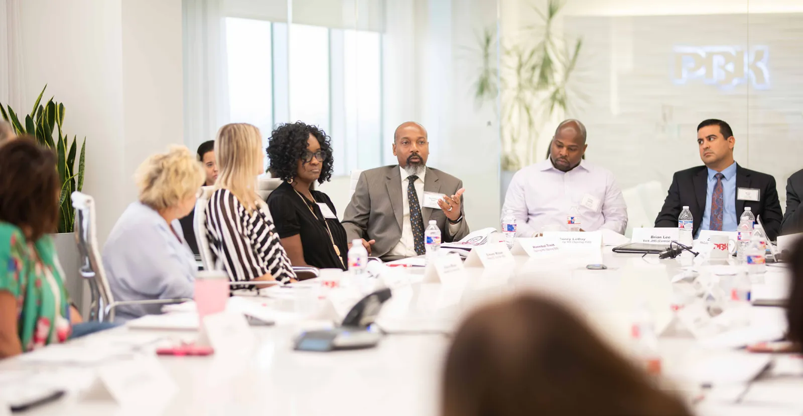 School administrators sharing campus safety planning experiences in a roundtable